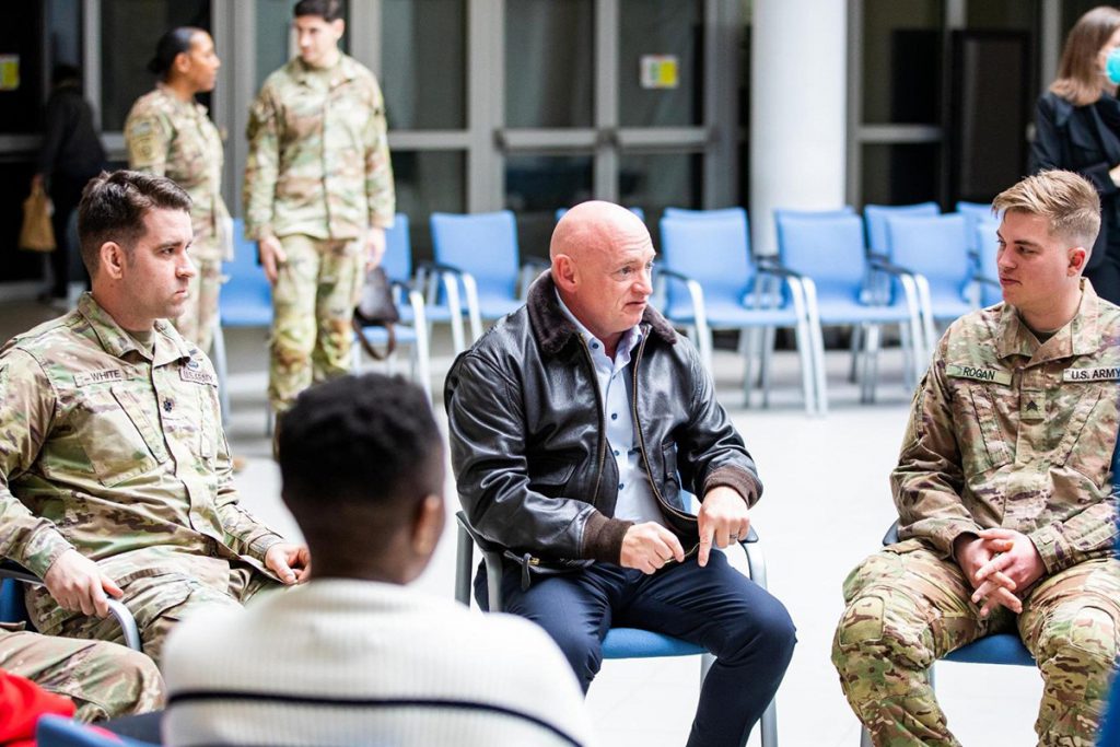 Mark Kelly meets with a group of Arizona service members stationed in Poland with the 82nd Airborne.