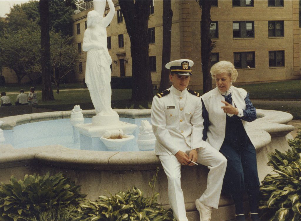 A young Mark Kelly sits with his grandmother on a fountain shortly after graduating from the U.S. Merchant Marine Academy and joining the Navy.